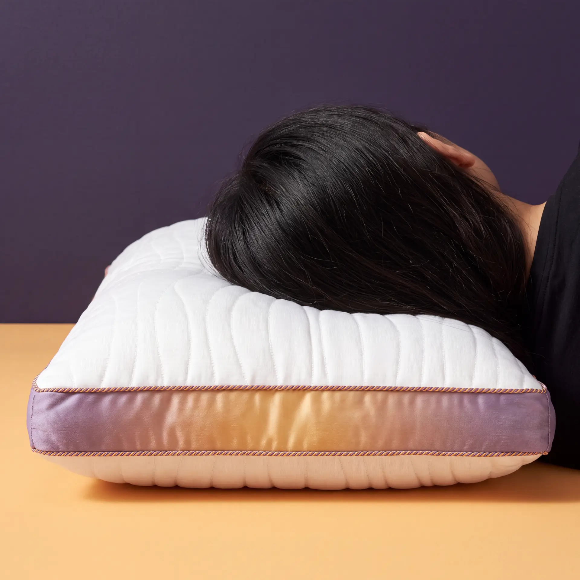 Person resting their head on the Stigma Sleep adjustable pillow